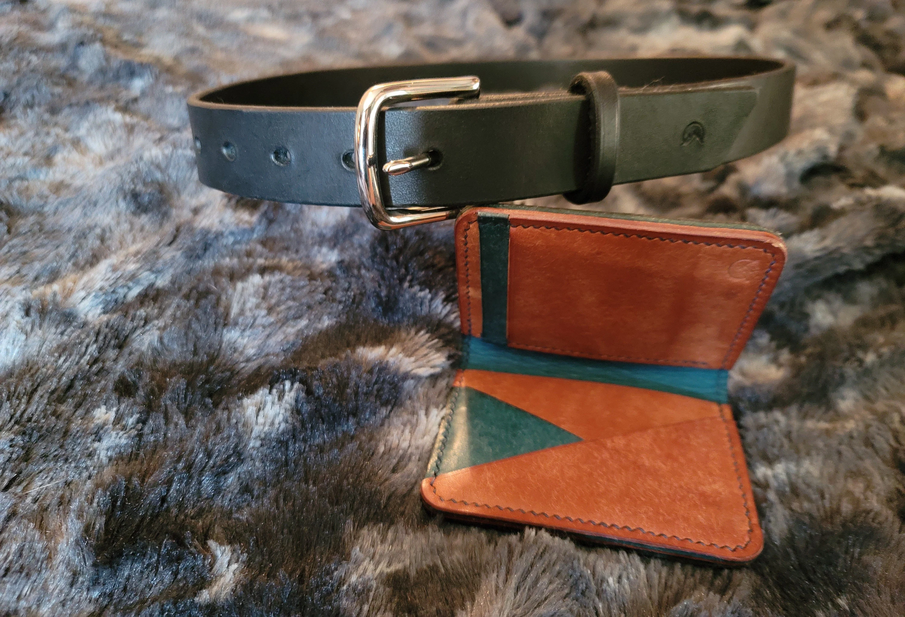 Customer photo submitted with James's Etsy review showing a green leather belt beside a custom wallet.