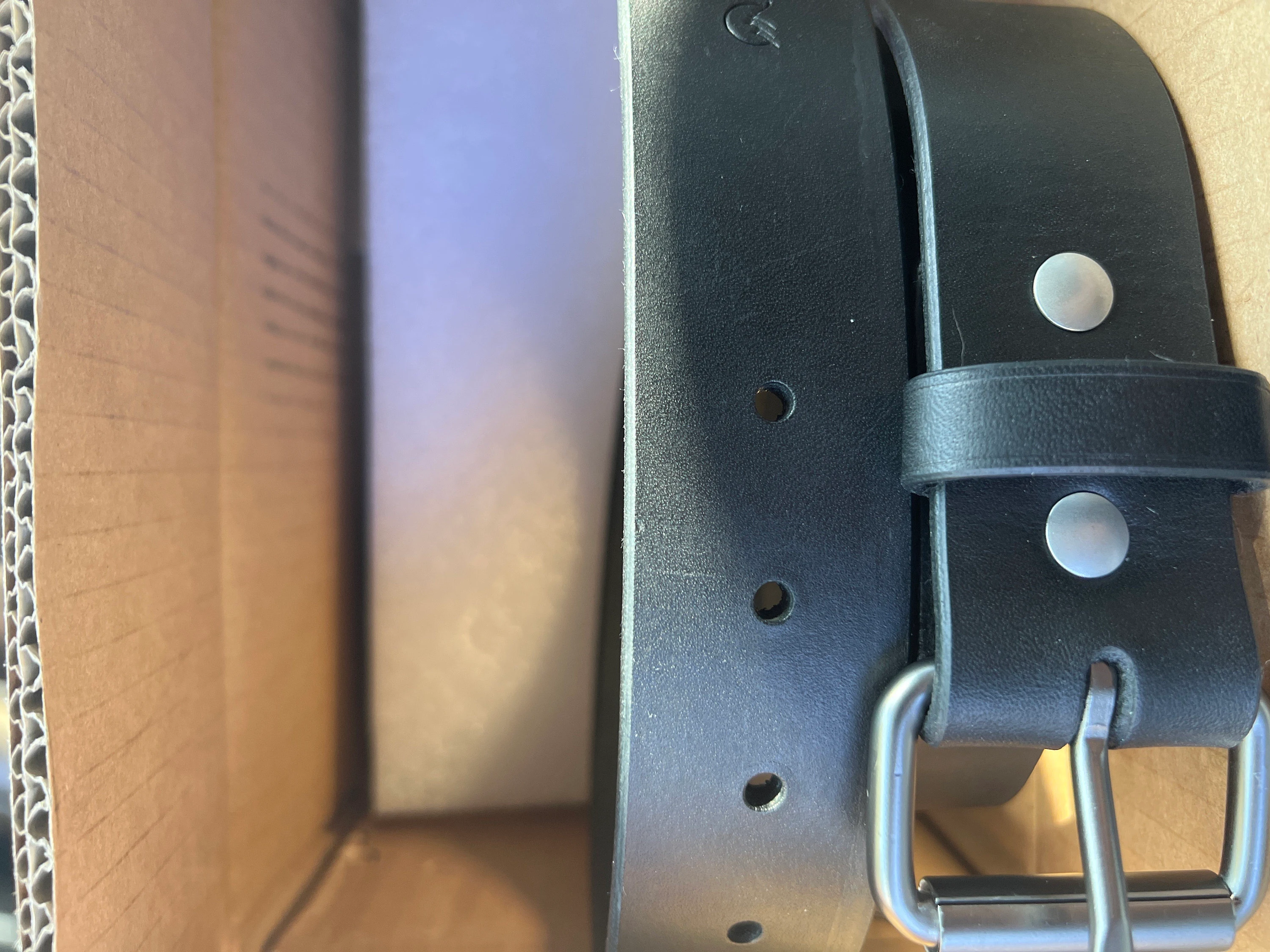 Customer photo submitted with Matt's Etsy review showing belt leather, hardware, and sizing holes.