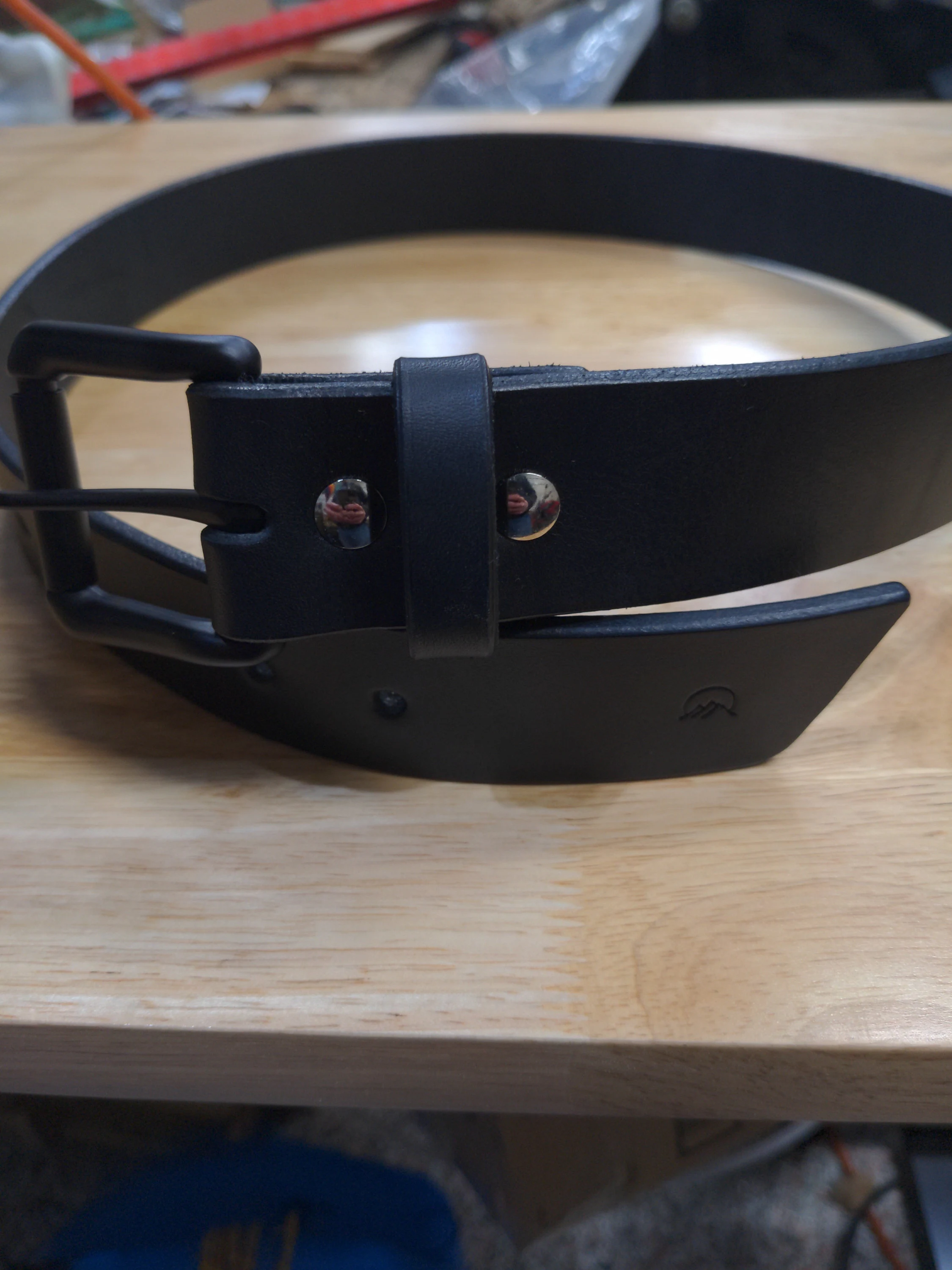 Customer photo submitted with Nathaniel's Etsy review showing a black Moonlight Leatherworks belt and buckle.